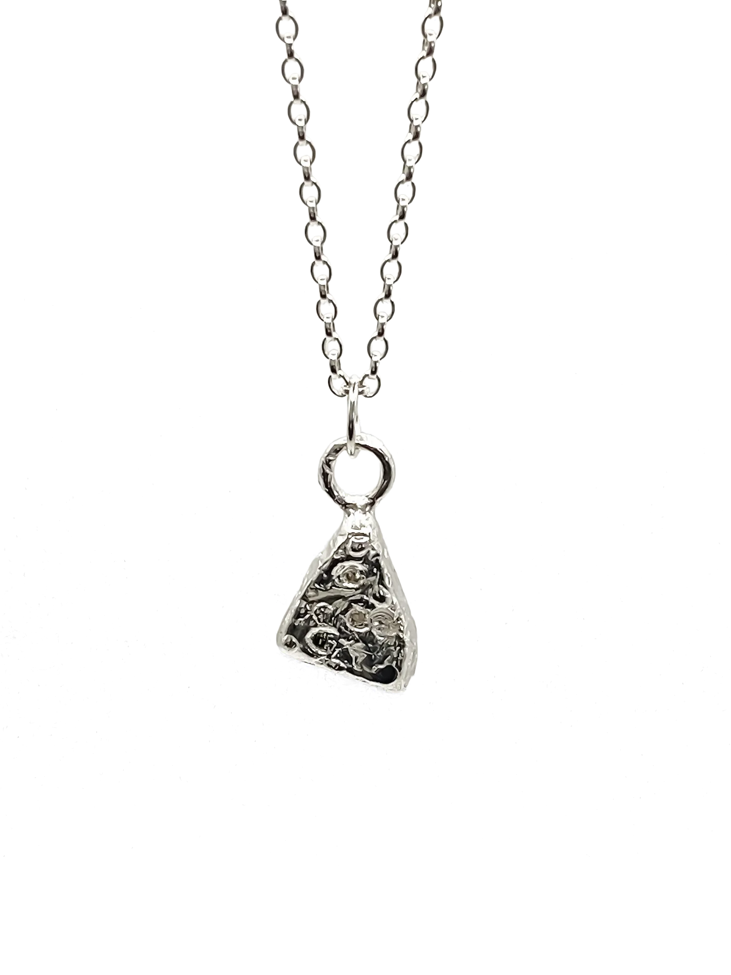 Silver triangular pendant with gemstone accents on chain.