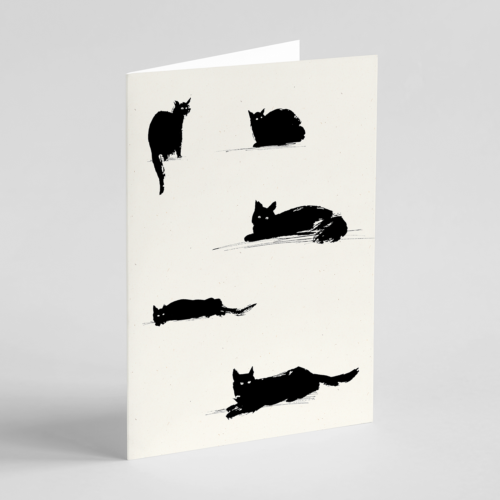 Lounging black cats greetings card