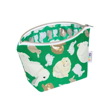 Green zipped pouch with rabbits illustrations on the outside and on the waterproof lining
