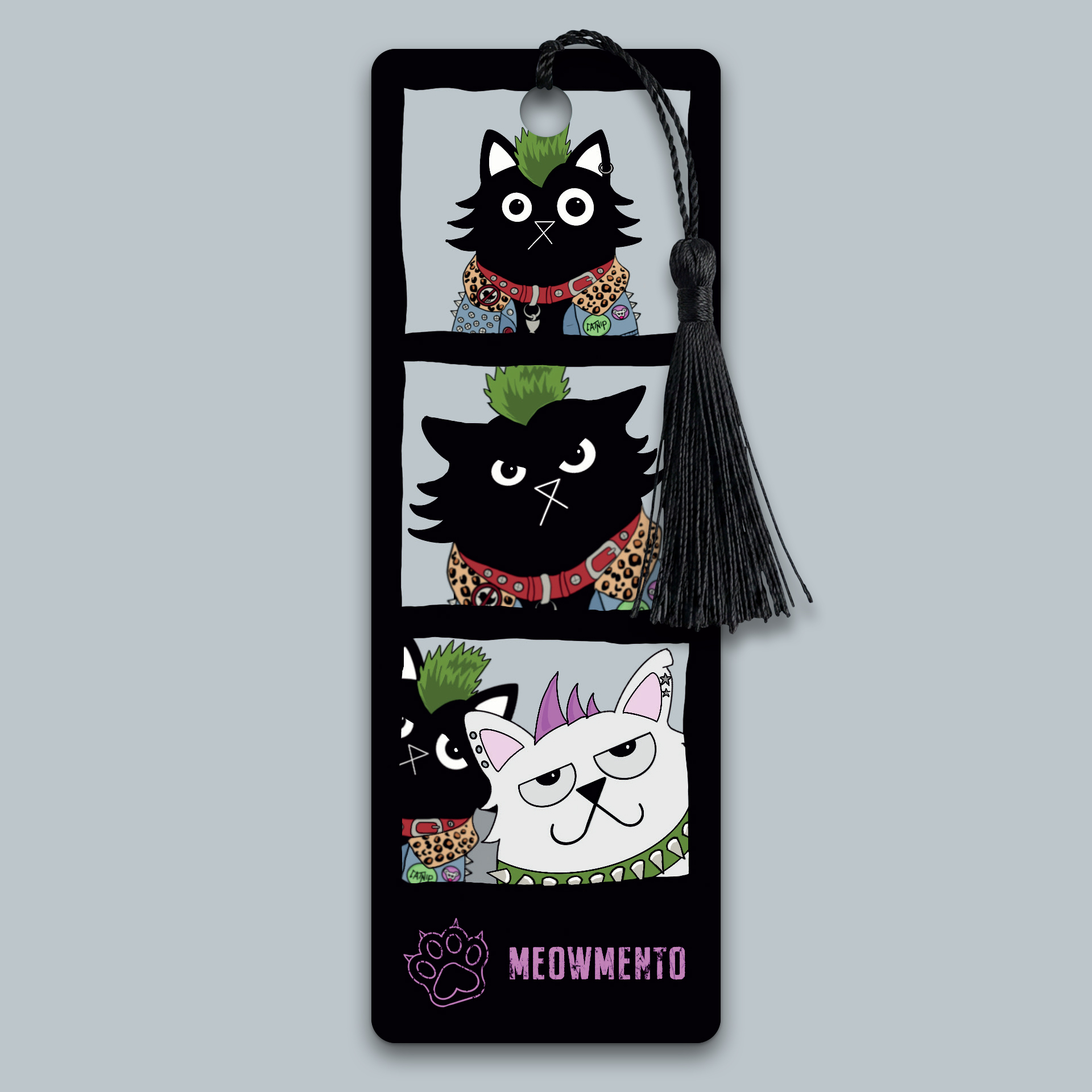 Illustrated bookmark styled as a photo booth strip, showing a green-mohawked black punk cat posing alone in the first two panels, then reacting with displeasure as a white cat with a purple mohawk joins the frame in the final panel. Black background. Black tassel attached. Original artwork by Baldy and the Fidget.