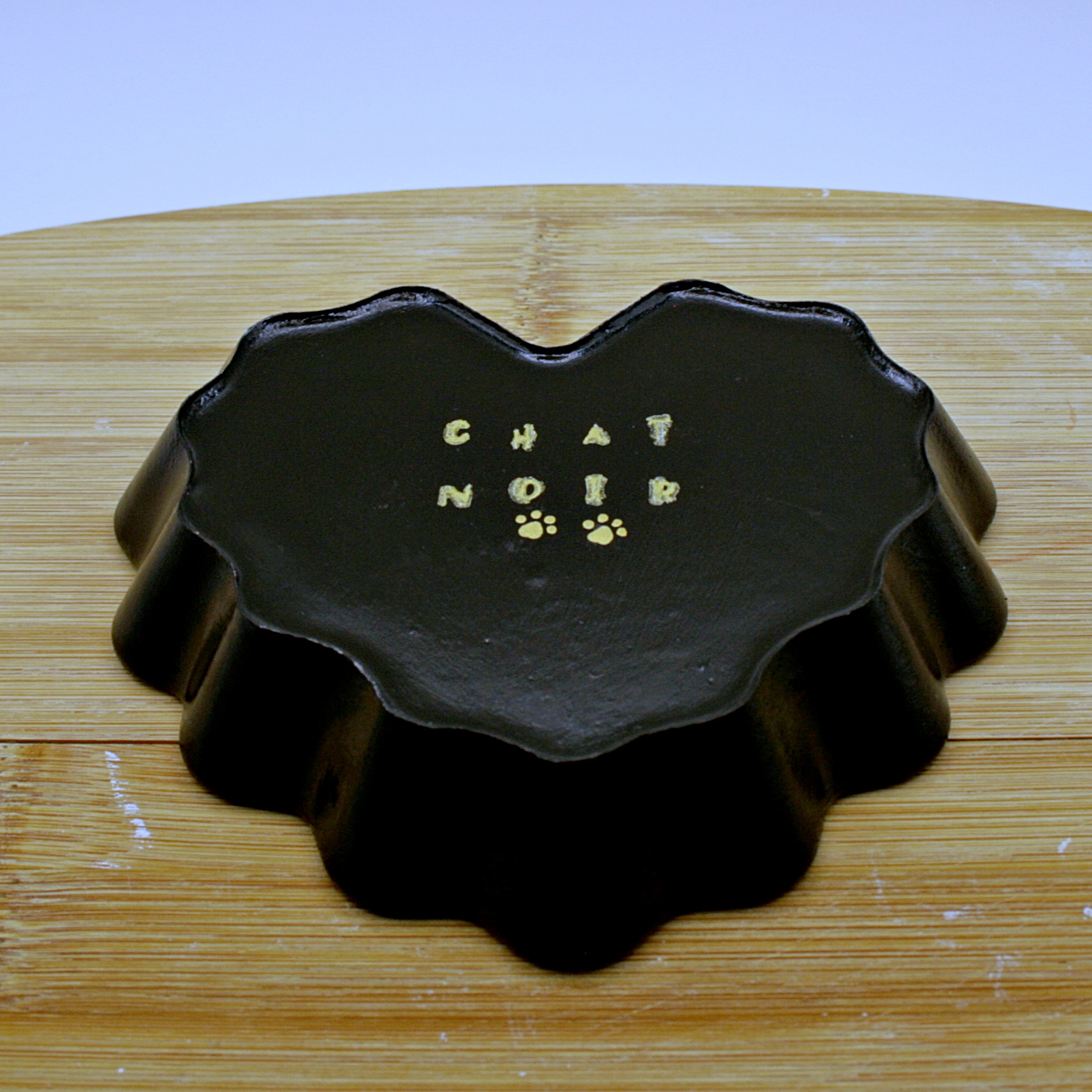 Back of the Heart shaped tray black with a cow skull painted on