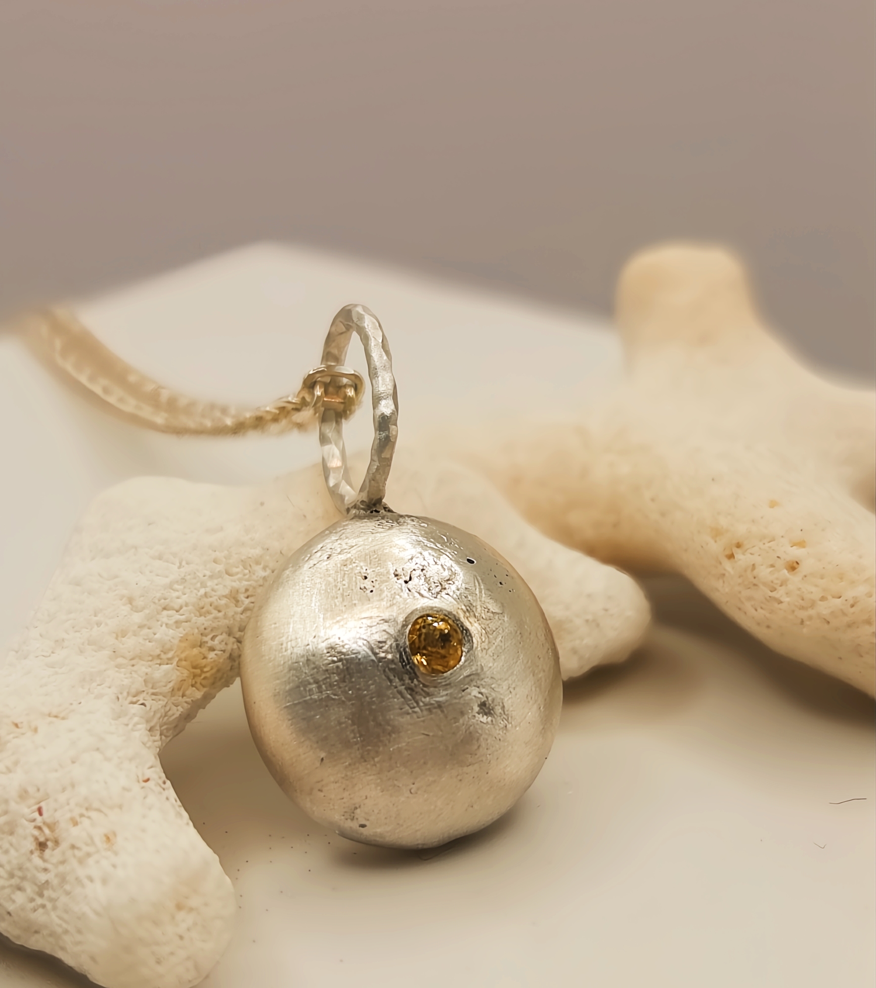 Molten Silver Pebble Pendant with Yellow Sapphire